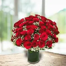 60 red roses with baby breath in glass vase - Blooming